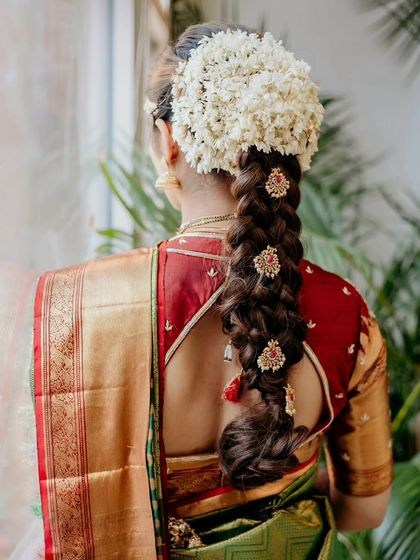 A quick hair and makeup change for the afternoon reception. We created a stunning traditional South Indian braid adorned with fresh jasmine and temple-style accessories.