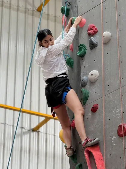 A climber enjoying a weekend session. Our gym is a place to find happiness, good vibes, and a great workout.
