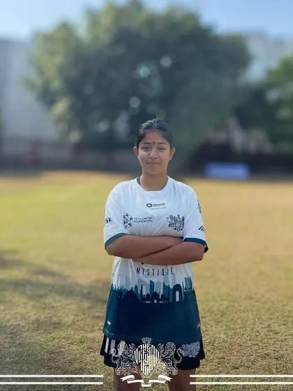 Strength and composure. Another one of our formidable players from the women's team, ready for any challenge.