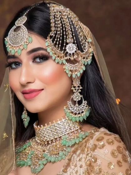 A beautiful pastel look with a mint green beaded set. This is a popular choice for modern brides.