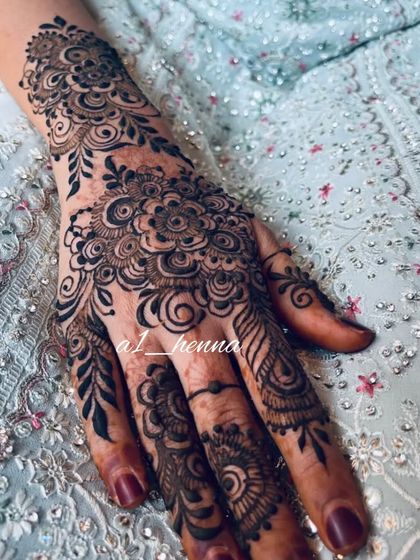 A close-up of the intricate floral Eid design.