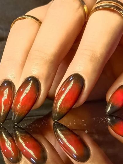 A close-up of the intense red and black cat-eye effect, showing the magnetic shimmer.