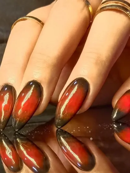 A close-up of the intense red and black cat-eye effect, showing the magnetic shimmer.
