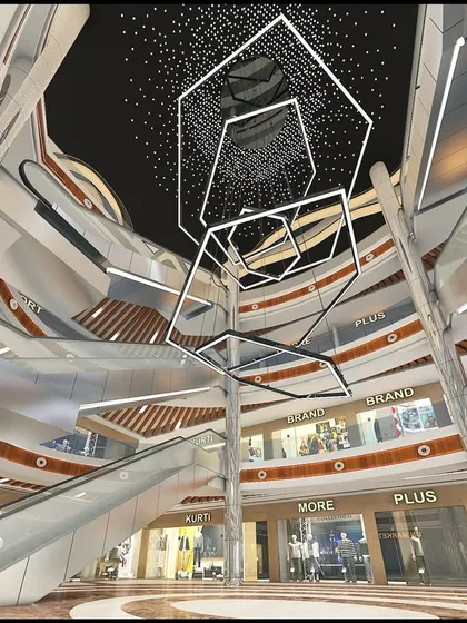 The atrium of the LP Walk Mall in Nagaon, Assam. Our design for this G+5 retail destination focuses on dynamic forms and fluid circulation, with multi-level visibility and a dramatic central lighting feature to create a vibrant shopping hub.