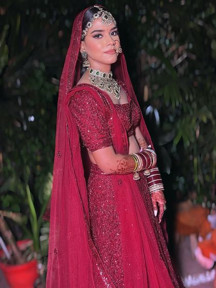 The full bridal look for Noor, showcasing the perfect draping of her dupatta and how the makeup complements her entire ensemble. My goal is to ensure you look flawless from head to toe.