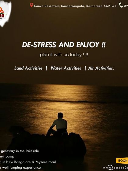 De-stress and enjoy. A silhouette of a person sitting by the water at night, finding peace.