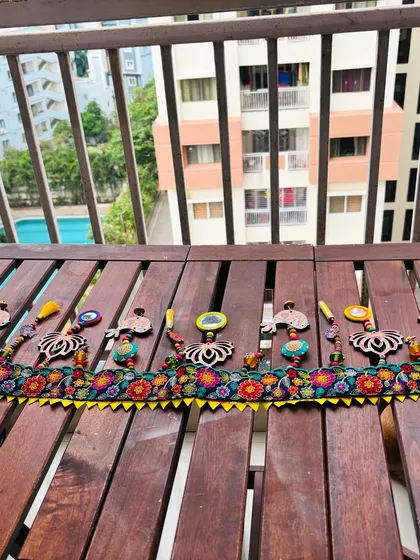 Here is my 'Tamaara' toran enjoying the morning sun on a balcony. Seeing my creations in a real home setting helps you imagine how they can bring color and joy to your own space.