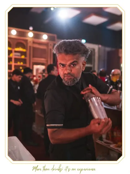 Our Senior Mixologist Saan is captured mid-shake, showcasing the energy and intensity that goes into creating a perfectly chilled and aerated cocktail. His expression reflects his passion for the craft.