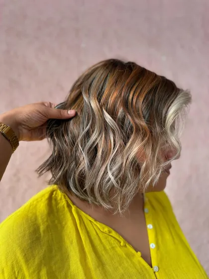 A side view of the sassy blonde burst bob. The mix of colors adds so much texture and movement to the hair.