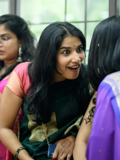 A friend's excited expression during a conversation. I'm always looking for these little moments of connection and emotion among the guests.