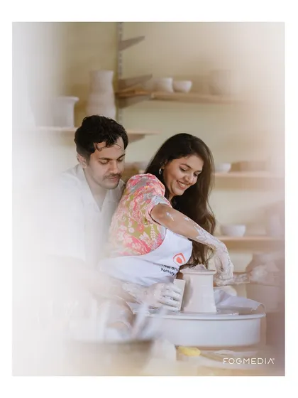 An artistic shot from the pottery session, with a soft, dreamy focus. This highlights the romantic and creative atmosphere of the activity.