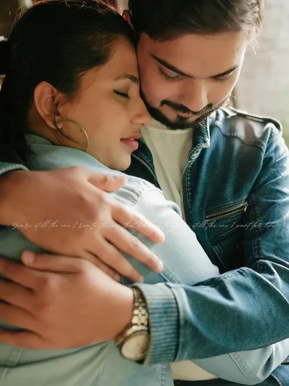A deeply intimate and emotional embrace. This close-up shot is all about the feeling of safety and love, a quiet moment that speaks volumes.