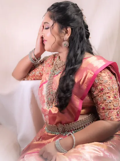 A serene and beautiful portrait of a bride at her reception. The soft makeup and elegant hairstyle make her look absolutely angelic.