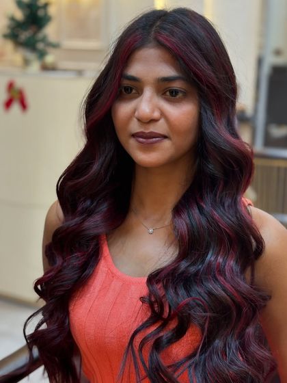 A vibrant red wine transformation. This image captures the beautiful, deep red tones and the healthy shine of the hair.