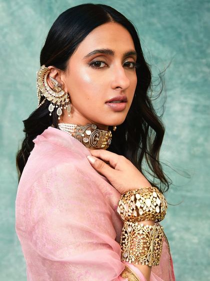 A stunning close-up of Akansha, showcasing the magnificent ear cuff and choker from Amrapali Jewels.