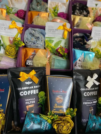 We create distinct wedding favors for all your guests, like this assortment for a recent celebration. This collection shows a mix of gifts for men and women, including premium coffee and post-shave balm alongside elegant scarves and skincare items, ensuring everyone receives a thoughtful and useful token of appreciation.