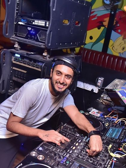 A wide shot of my complete audio-visual setup, with multiple laptops and Pioneer decks. This is the gear I use to create a full sensory experience.