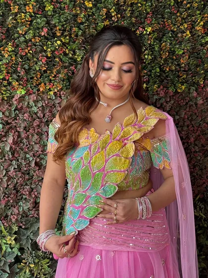 The gentle waves and simple twist at the back create a graceful and feminine look, perfect for a wedding guest or for a pre-wedding function.