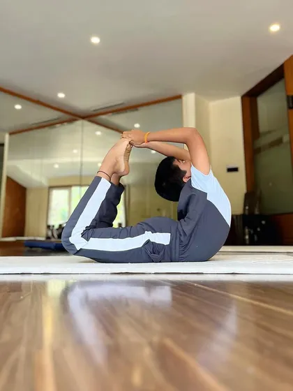 This student shows great progress in his bow pose. We believe in celebrating the journey of improvement, not just the final result.