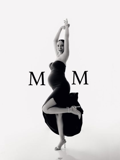 Mamma Mia. A joyful and energetic black and white portrait that celebrates the power and fun of being a mom.