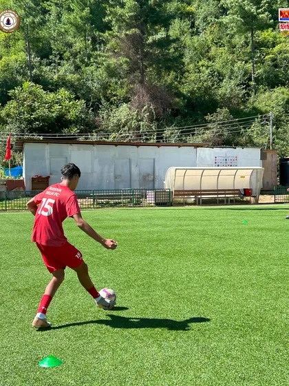 A player practices his shooting technique on the pristine pitches of Bhutan. We are grateful to the Bhutan Football Federation for hosting us and providing world-class facilities for our training camp.