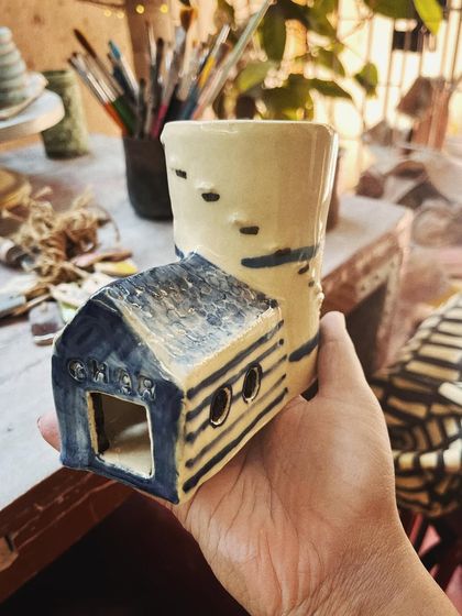 This student took to pottery like a fish to water. In her advanced course, she created this massive, beautiful planter, a real achievement that shows her dedication and skill. I am so proud of her.