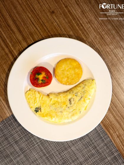 A smiley-face omelette, a fun and cheerful option from our live egg station to brighten up your morning.