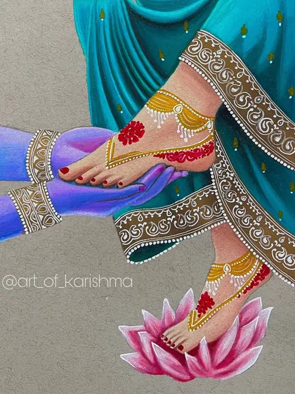 A beautiful depiction of Radha and Krishna's divine love, symbolized by their feet. This piece is rich with intricate details, from the alta on her feet to the delicate jewelry.