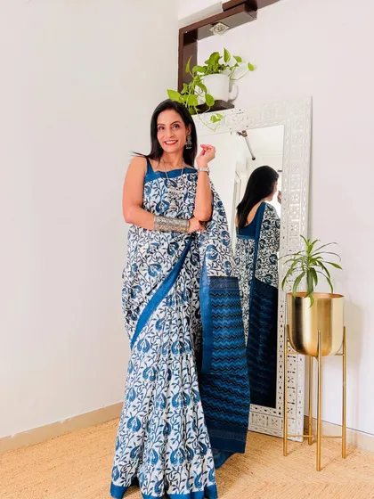 This blue and white block-print style saree is a classic and timeless workwear piece. It's made from a soft, manageable fabric that is perfect for a long day at the office.