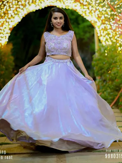 A beautiful shot of our iridescent lavender lehenga, perfect for a pre-wedding event or sangeet. The flowing skirt is designed to create a magical twirling effect in photos and videos.