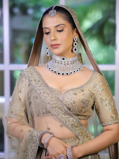 Another angle of the ivory look, showing the delicate shimmer on the eyes and the perfectly blended skin, creating a flawless and timeless finish.