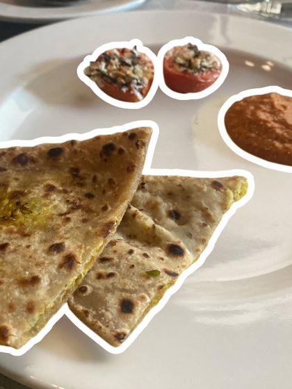 Stuffed parathas with a side of baked tomatoes and chutney. Wholesome, satisfying, and completely aligned with a healthy lifestyle.