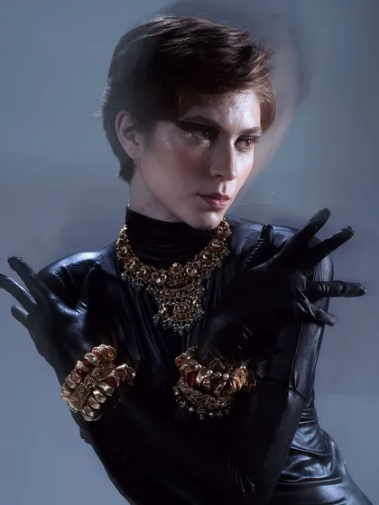 The use of slow shutter speed in this photo adds a sense of movement, while the sharp makeup and hair remain the focal point.