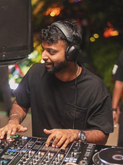 A happy, candid moment of me mixing. The smile is genuine; this is my happy place.