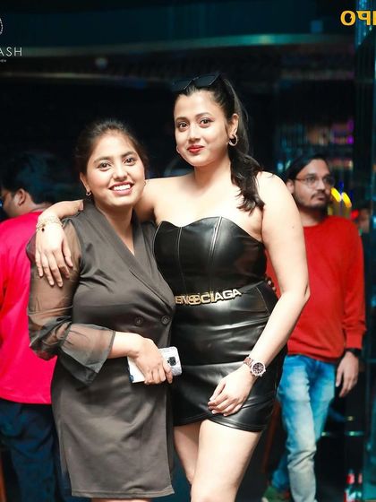 A stylish duo enjoying the music and the atmosphere at Badmaash.