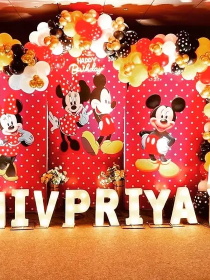 The complete Mickey and Minnie Mouse stage for Shivpriya's 5th birthday. The large light-up letters spelling out the name add a personalized and celebratory touch.
