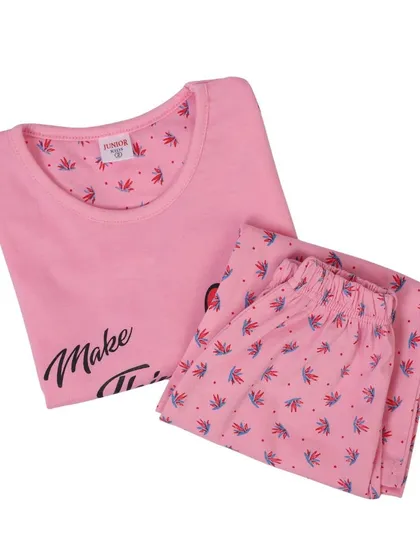 A folded pink pajama set for kids, shot from an angle. This type of product photography helps showcase the item in a compact and neat way.