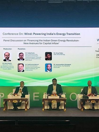 The panel on "Financing the Indian Green Energy Revolution" is seen on stage at the Windergy India Conference. Our firm's participation signifies our expertise in the renewable energy sector.
