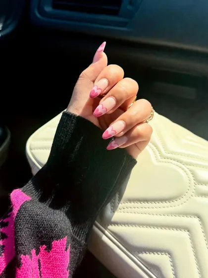 Wearing my heart on my nails this Valentine's. This design features a sheer base with a modern French tip created in the shape of a pink heart.