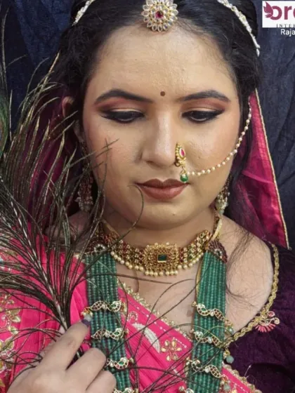 This creative shot with a peacock feather adds an artistic touch, highlighting the royal and majestic theme of the makeup.