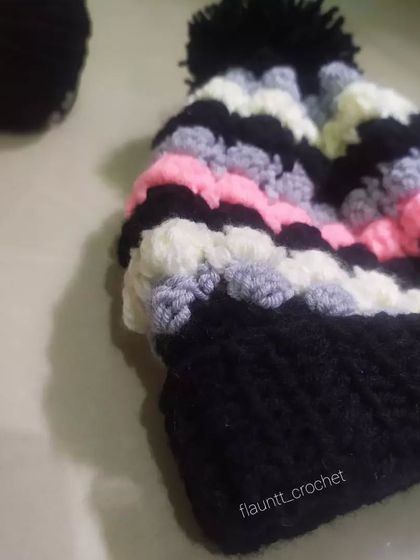 A detailed view of the Dolci Beanie, highlighting the textured stitches that give it a unique and modern look. It’s a quick and fun piece to make.