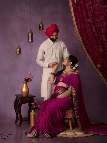 A romantic seated portrait, capturing the intimate connection between the couple. The elegance of their attire is simply timeless.