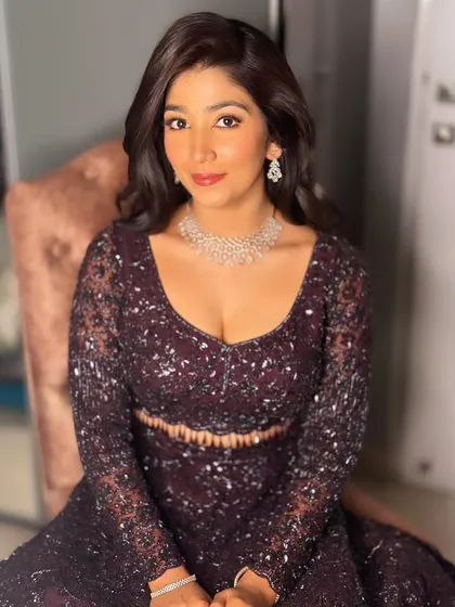 Sanjana looking radiant and ready to celebrate. The soft glam makeup ensures she looks her best all night.
