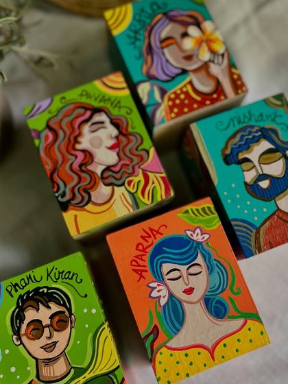 More of the custom-painted pen stands, each with a unique name and portrait in our signature style.