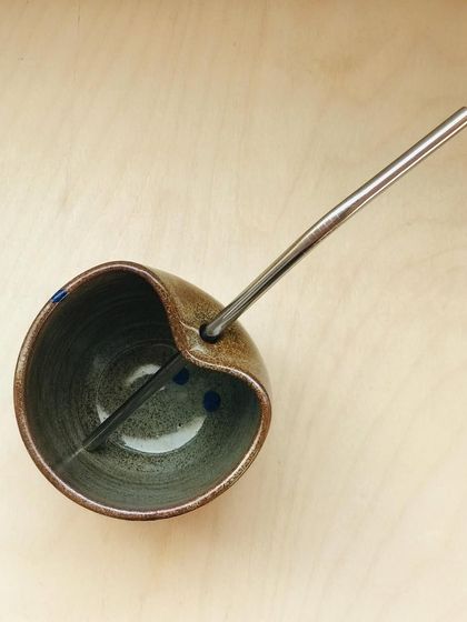 The "Sip Buddy" with a metal straw, ready for use. This design is my answer to making sustainable choices more beautiful.