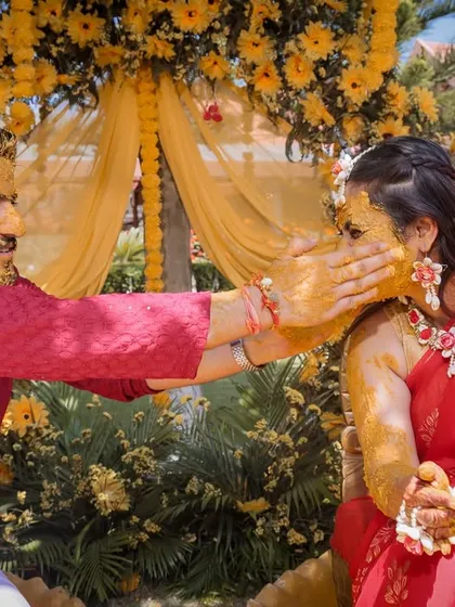 A playful moment where the groom applies Haldi to the bride. These unscripted interactions are the heart of my candid wedding photography.