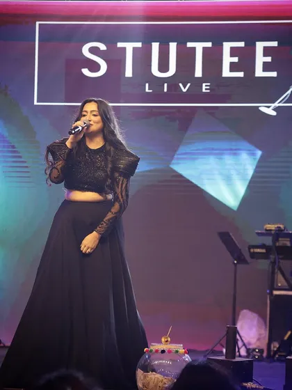 A full-length shot of me performing on stage. My stage presence and attire can be adapted to suit the formality and style of your corporate or private gathering.