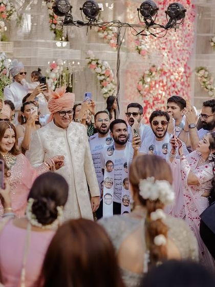 The joy and celebration as the bride and her family make their way to the stage.