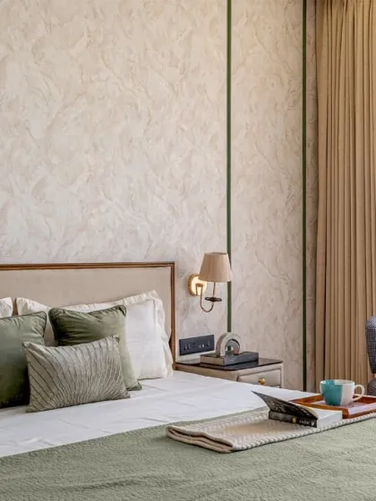 This angle highlights the seating nook I created in the master bedroom, featuring a custom-made armchair. It’s a perfect spot for relaxing, placed to take advantage of the natural light from the large window.