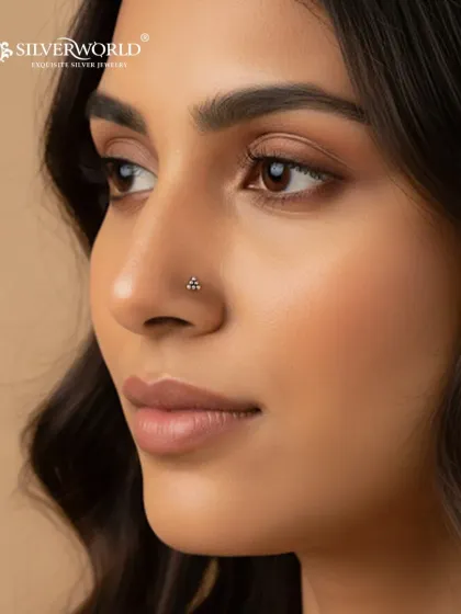 A perfect example of minimal elegance, this tiny three-dot silver nose pin is one of our most popular items for daily wear. It's handcrafted from pure 92.5 silver and designed to add a subtle sparkle.